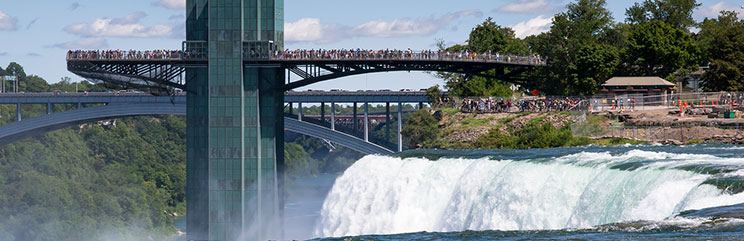 Waterfall with bridge in background